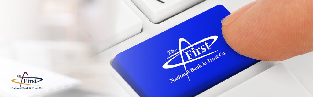 Image shows a finger on a keyboard with the FNBT logo showing