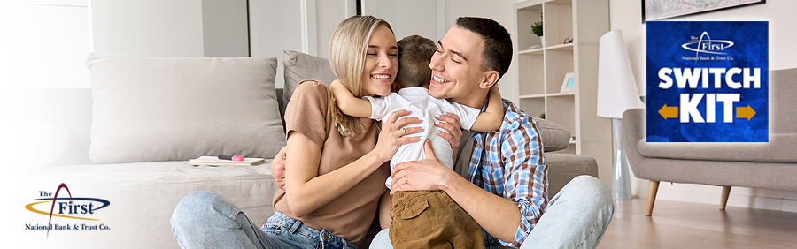 Young couple embracing their child with Switch Kit logo beside.